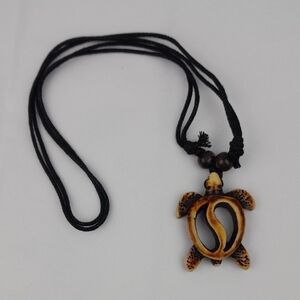 Carved Wooden See Thru Swirl Turtle Necklace